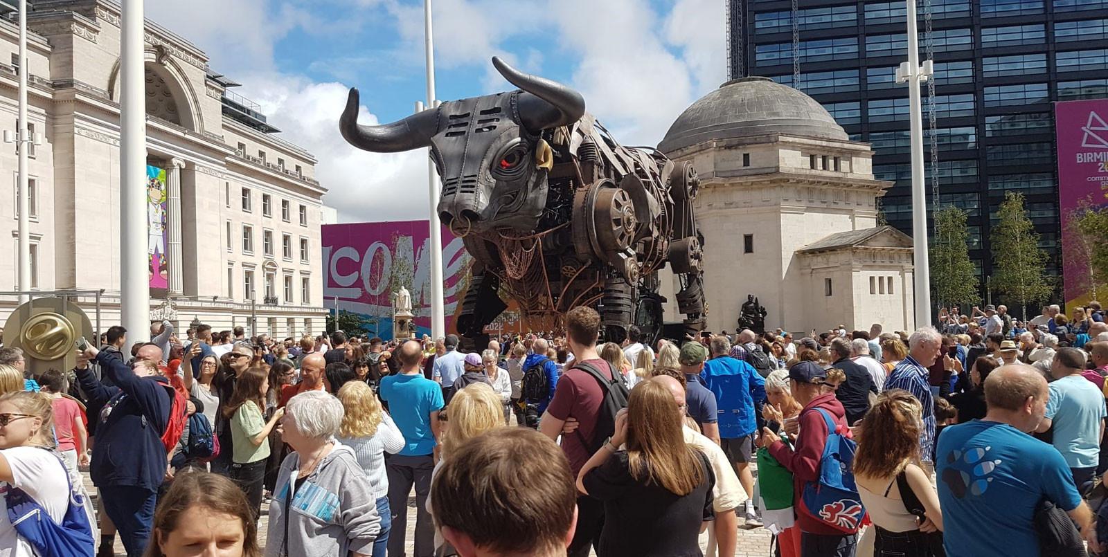 Ozzy the mechanical bull outside in Birmingham with a crowd surrounding taking photos